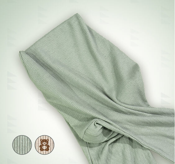 A folded soft sage green spare cover for the Wedge, shown against a light off-white background with two circular inset detail images in the bottom-left corner.