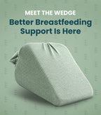 A light sage green wedge breastfeeding support pillow shown on a matching sage green background with promotional text reading 'MEET THE WEDGE Better Breastfeeding Support Is Here'.